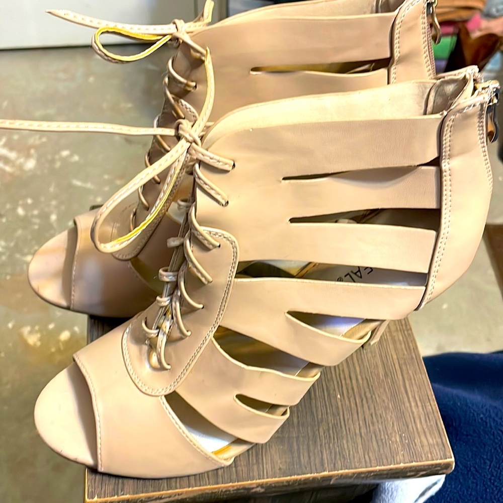 The heels are string up with vegan materials. Heels are 3 1/2 inches high.